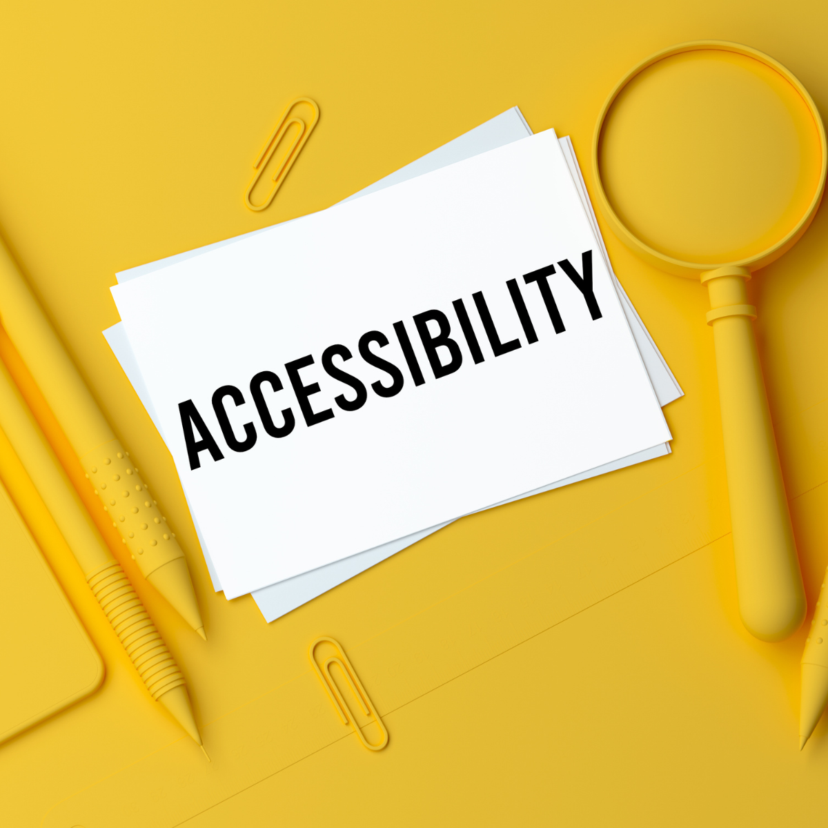 A piece of paper against a yellow background that reads Accessibility