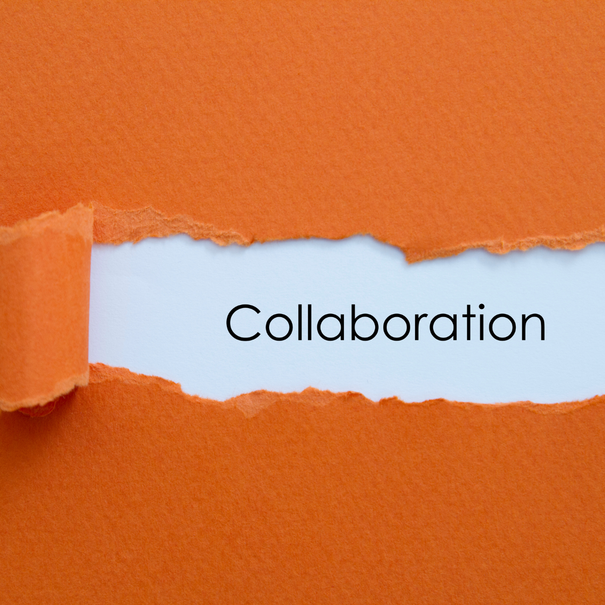 A ripped piece of paper revealing the word Collaboration