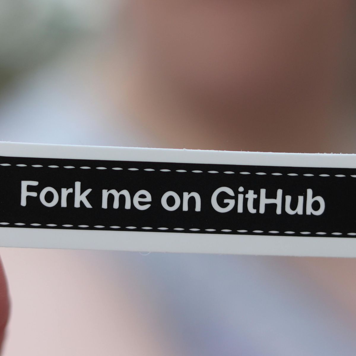 A sticker that reads 'Fork me on GitHub