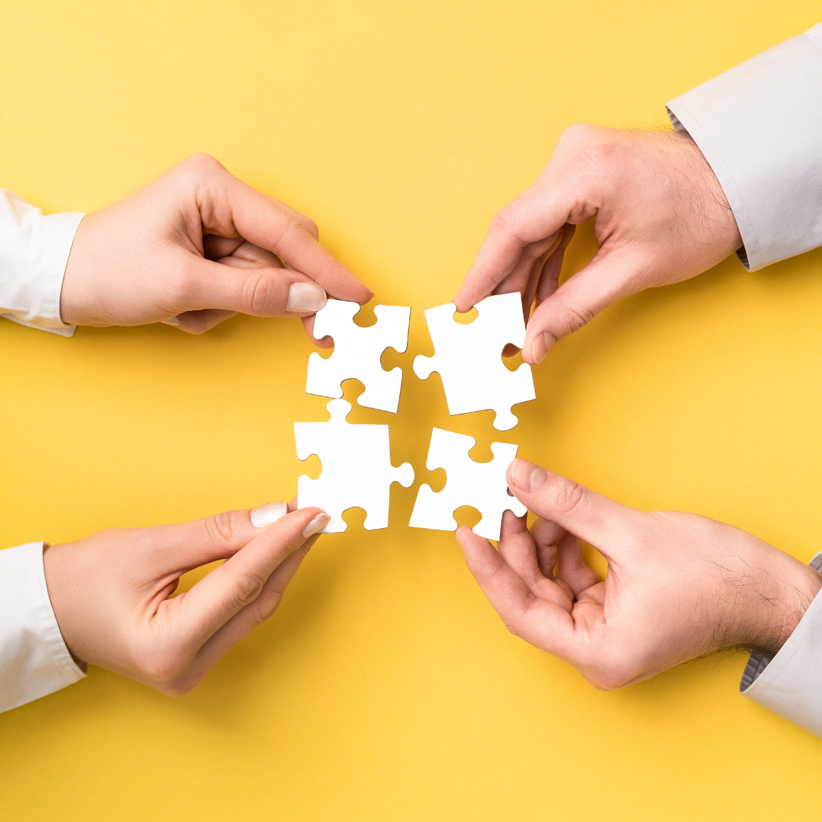 4 puzzle pieces joining together